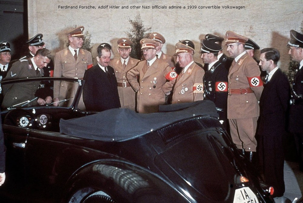 Ferdinand Porsche, Adolf Hitler and other Nazi officials admire a 1939 convertible Volkswagen