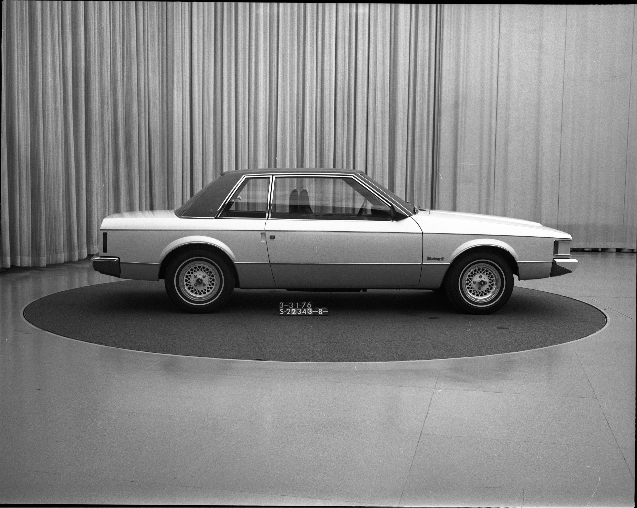 Another rather conservative design, and since it was the 1970s a vinyl roof concept was expected. This model uses much more chrome around the daylight opening and features unique door handles tucked into the back of the door and accessed via a recess on the body, similar to the 1989 Ford Probe