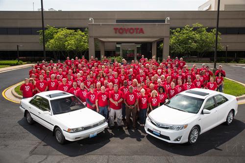 Toyota Motor Manufacturing, Kentucky, Inc. (TMMK) team members celebrate 10 million vehicles assembled at the plant, posing with the "first" Camry built in 1988 and the milestone vehicle, a Camry Hybrid, built in 2014.
