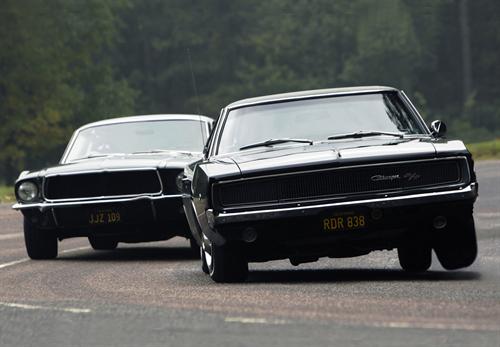 Dodge Charger and Ford Mustang recreating the legendary car chase from Bullitt at Silverstone.