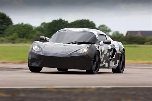 A Detroit Electric SP:01 electric sports car, under a non-production prototype body, undergoes dynamic testing at a facility in Europe.