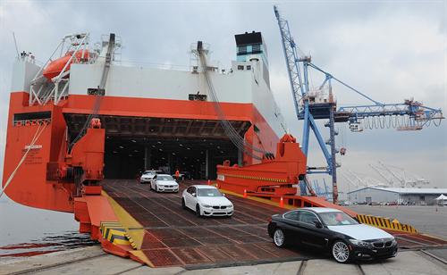 BMW vehicles coming off of the Wallenius Wilhemsen Logistics vessel during the official opening of BMW's newest Vehicle Distribution Center on September 18, 2014 in Baltimore, Maryland.